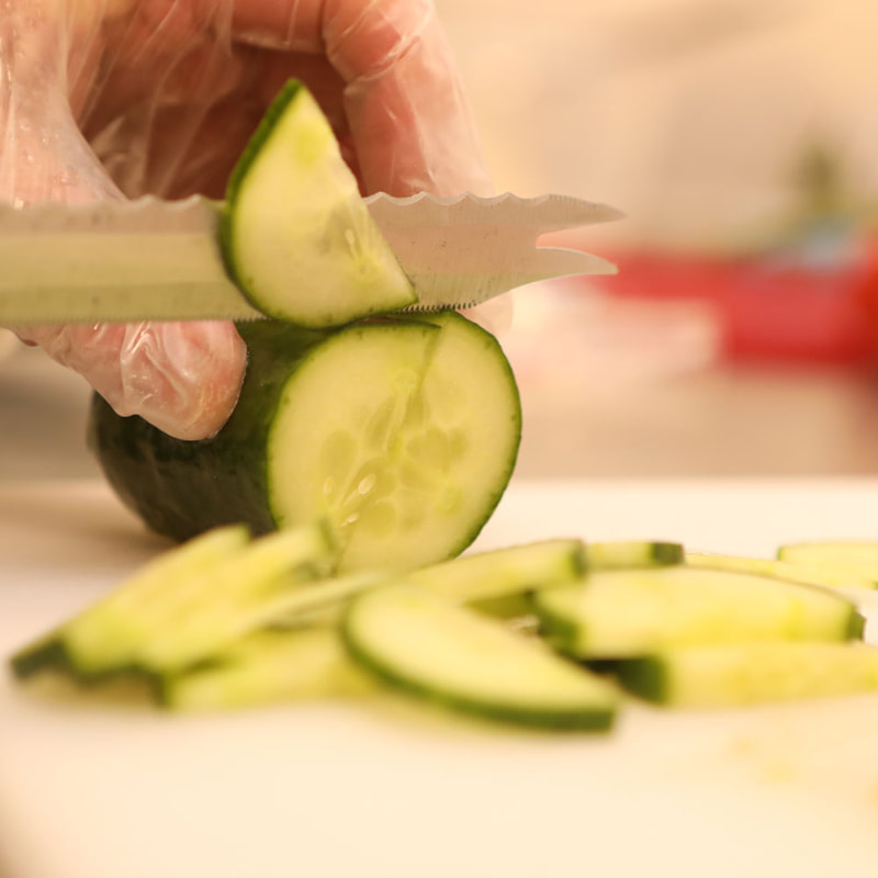 Martinas Homemade Foods preparing fresh cucumber