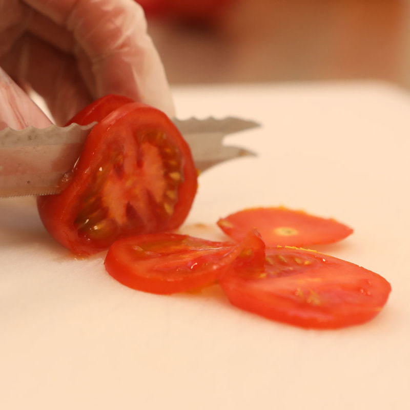Martinas Homemade Foods preparing fresh tomato